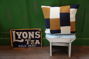 Hand knitted pure wool cushion. Harlequin 
